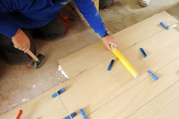 person installing new hardwood floors